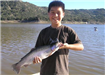 10-year-old Matthew Le of San Diego, 3.20 pound Trout caught 1-17-11 on Nightcrawler in Boat Dock Co