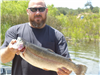 Jason Volberg of Ramona, 5.70 pound trout caught 4-22-22 using a gold kastmaster in Oakvale Cove.