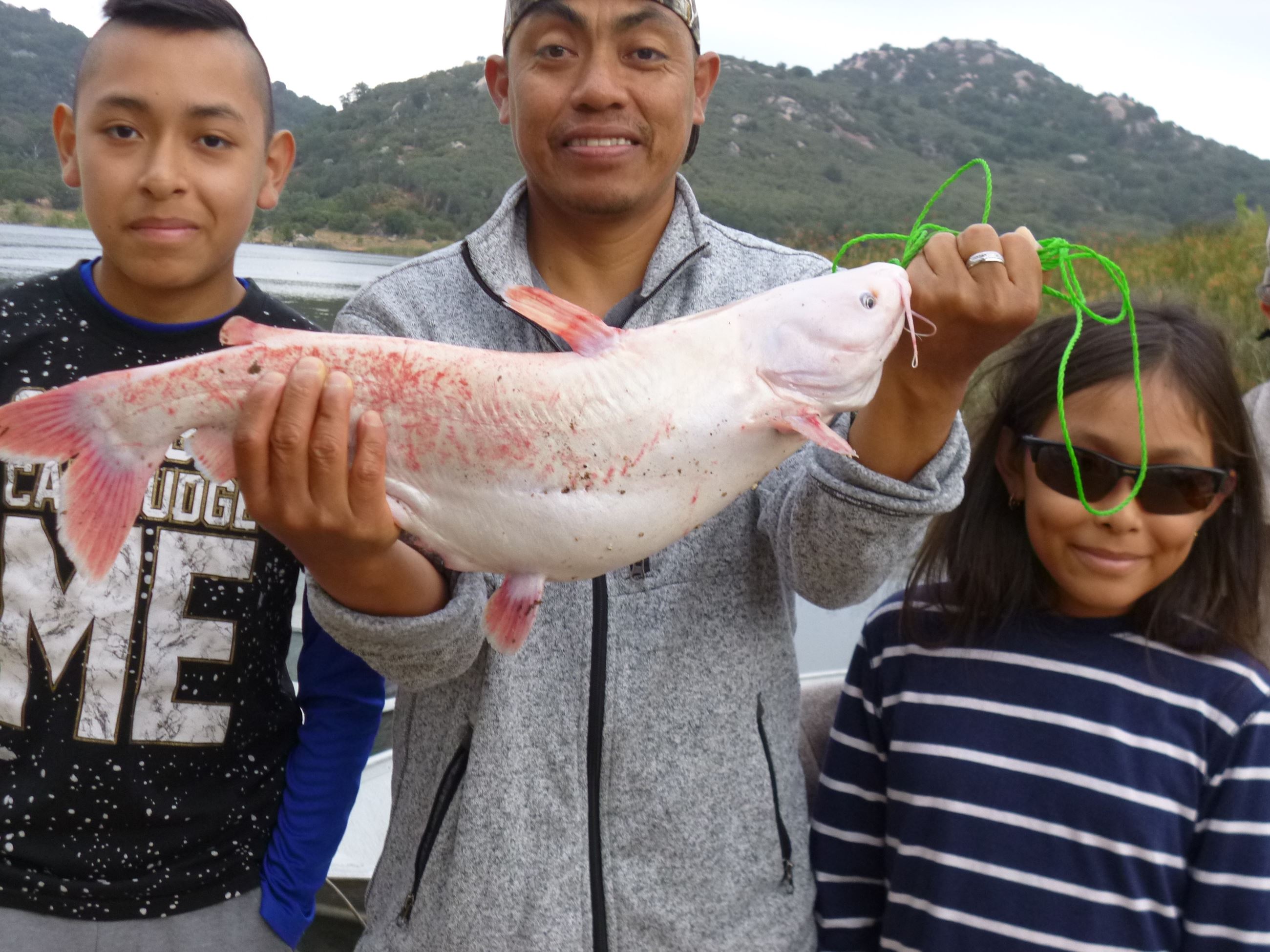 Adalberto Perez of Escondido, 5.50 pound albino catfish caught 5-21-22 using shrimp at Twin Peaks.